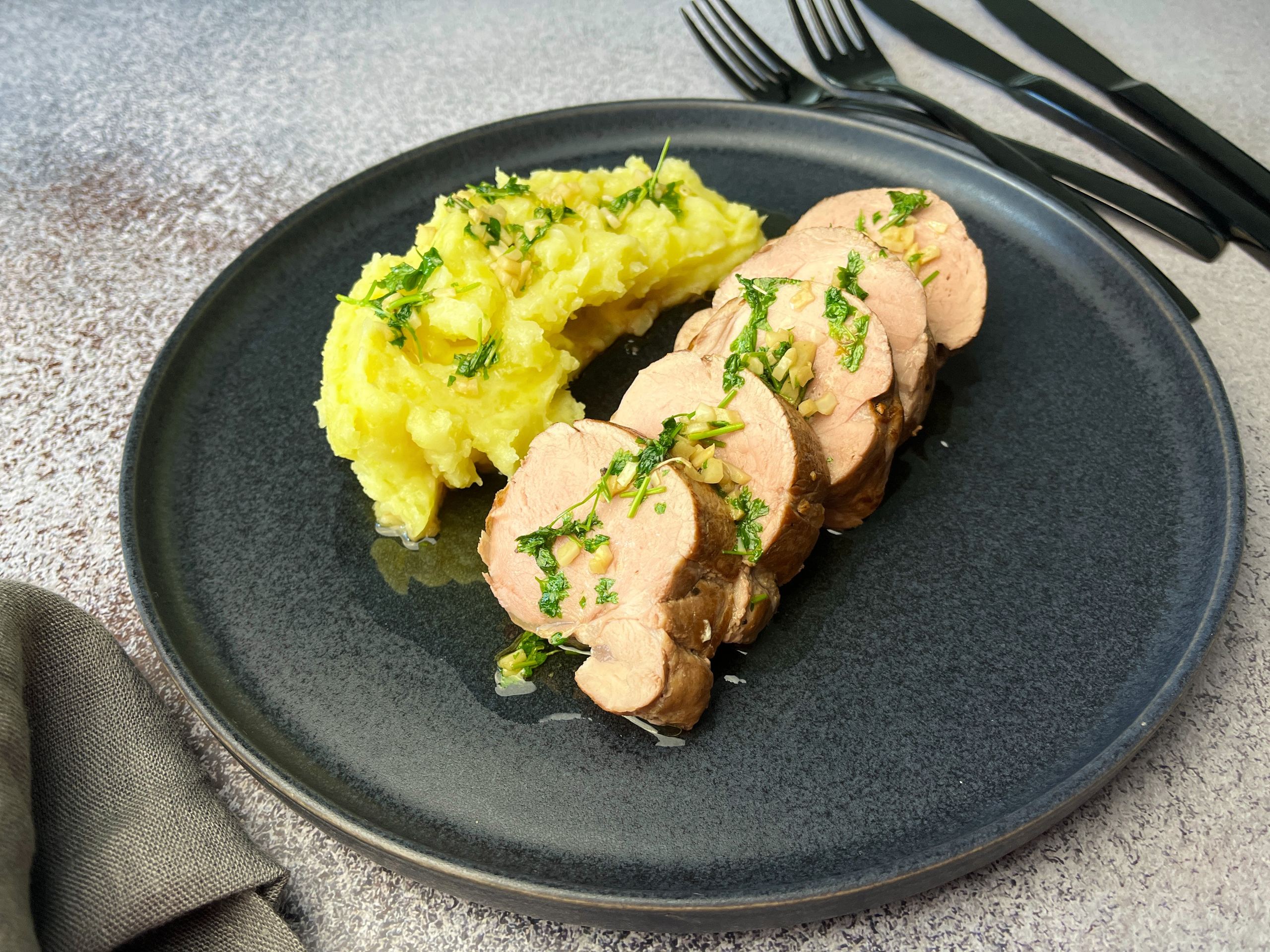 Pork tenderloin with garlic butter sauce